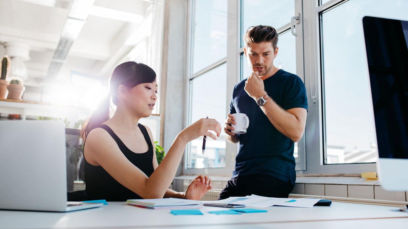 coworkers-discussing-business-ideas-PWAASLV