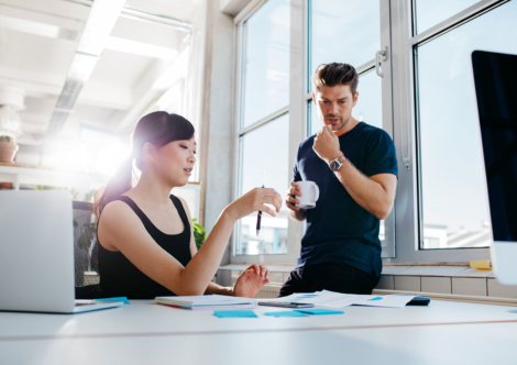 coworkers-discussing-business-ideas-PWAASLV